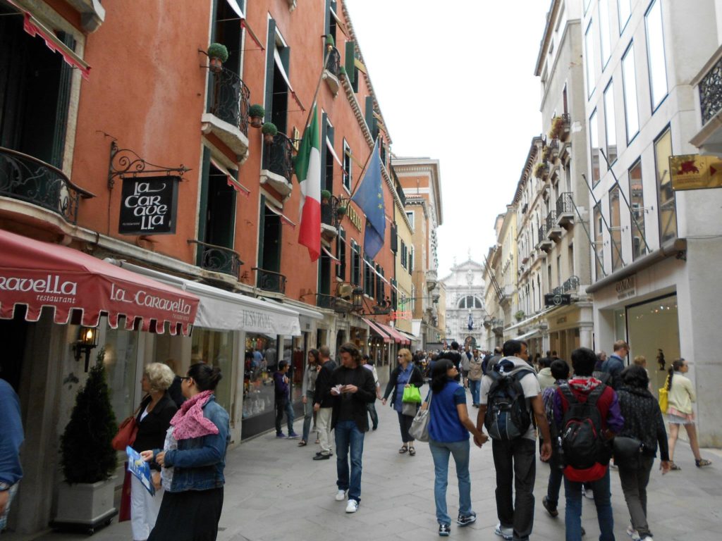 My parents walking through the streets of Venice