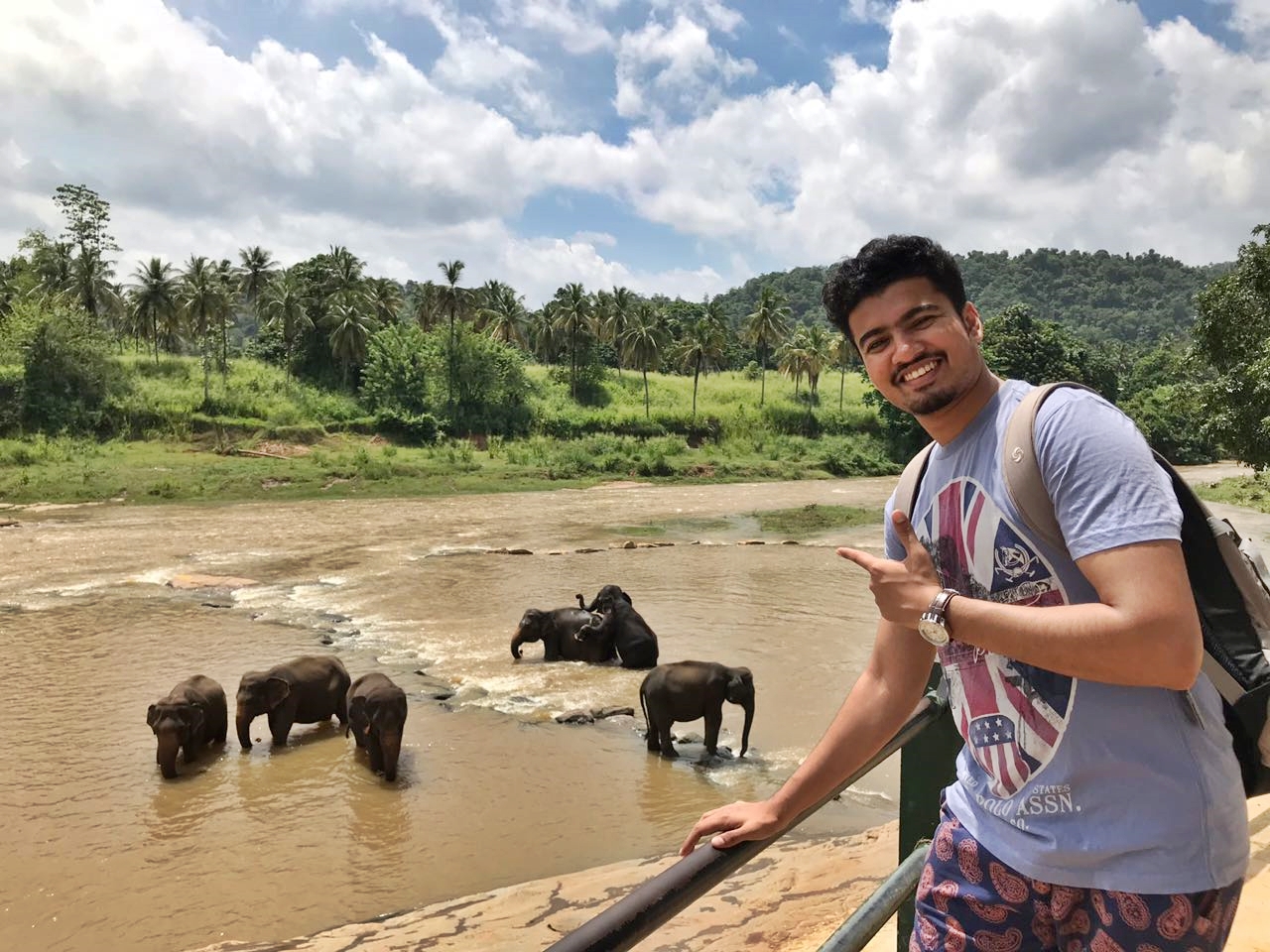 Me invading the privacy of the elephants while they were bathing