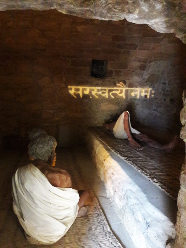 The Hindu mantra "Saraswatyai Namah" projected on a wall in the temple