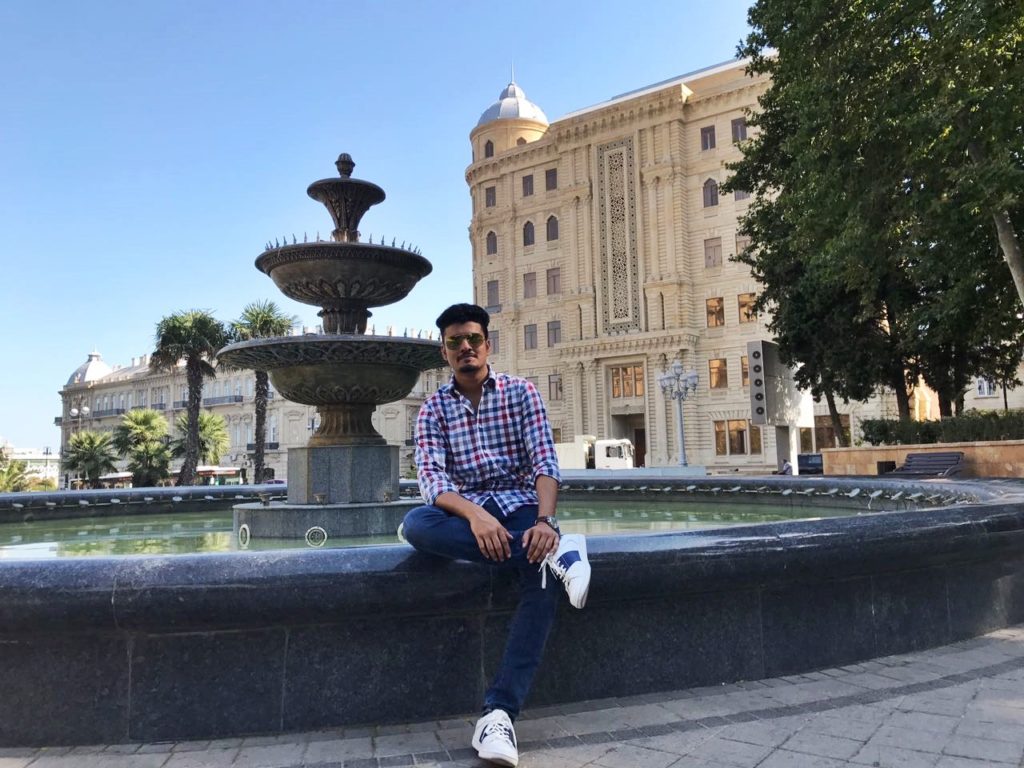 Me sitting at the fountain side in front of the Heydar Aliyev Govt. Center