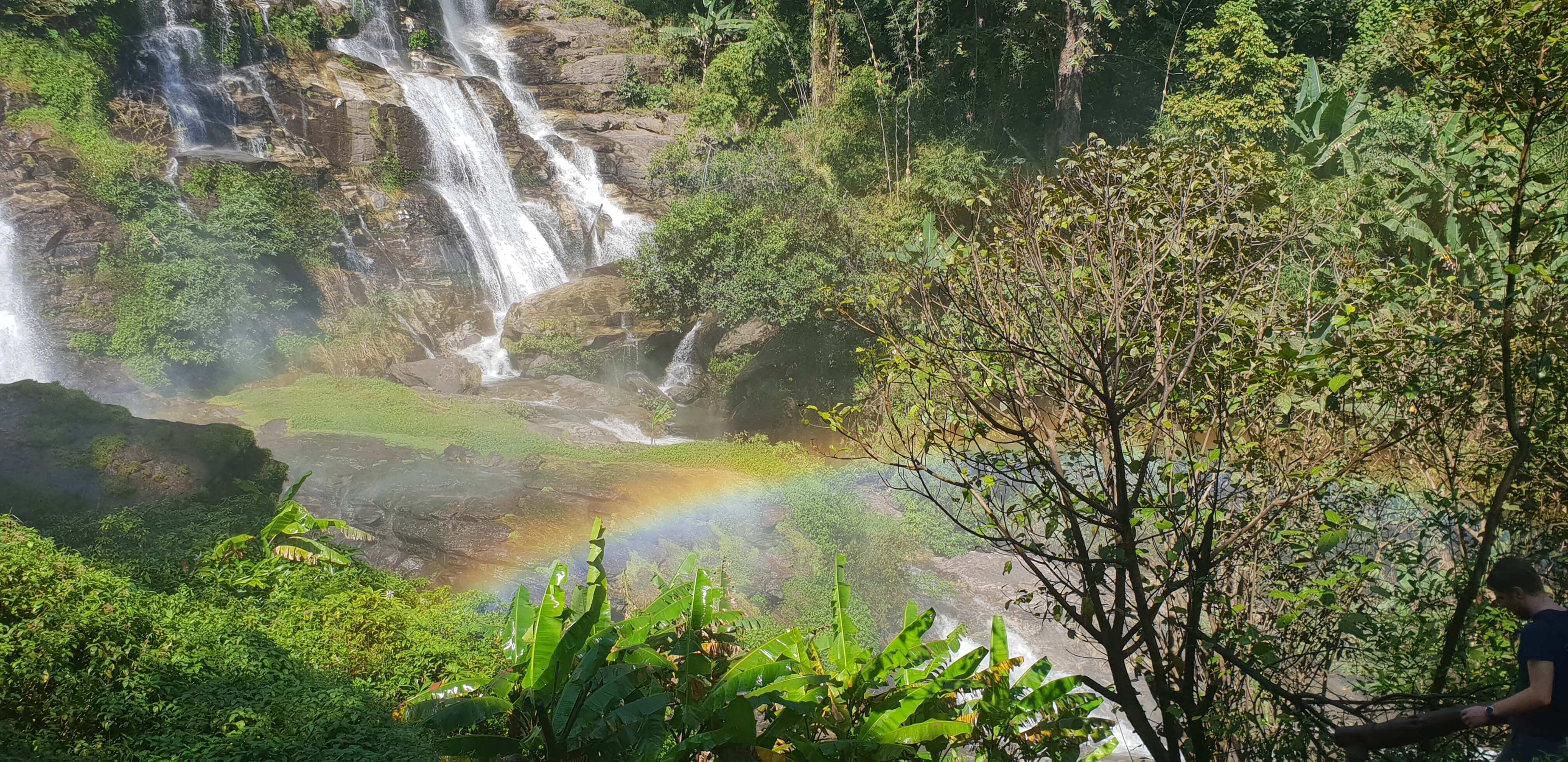 A surreal rainbow at the base of the Wachirathan waterfall