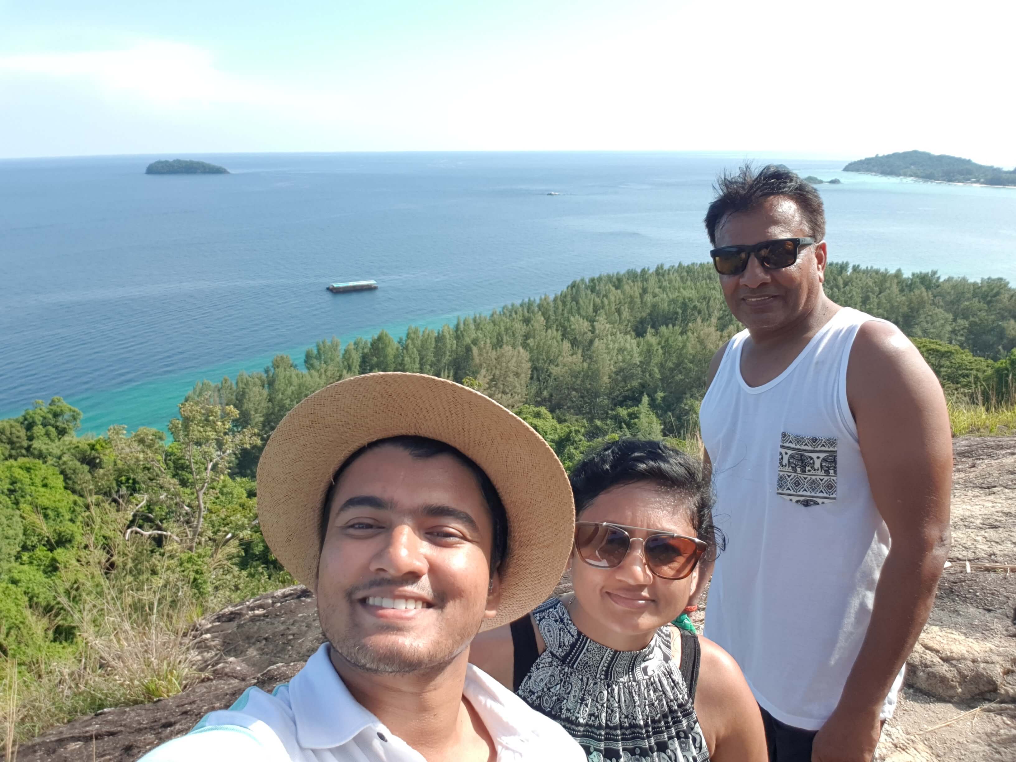 My family is all smiles after reaching the Koh Lipe viewpoint at Koh Adang