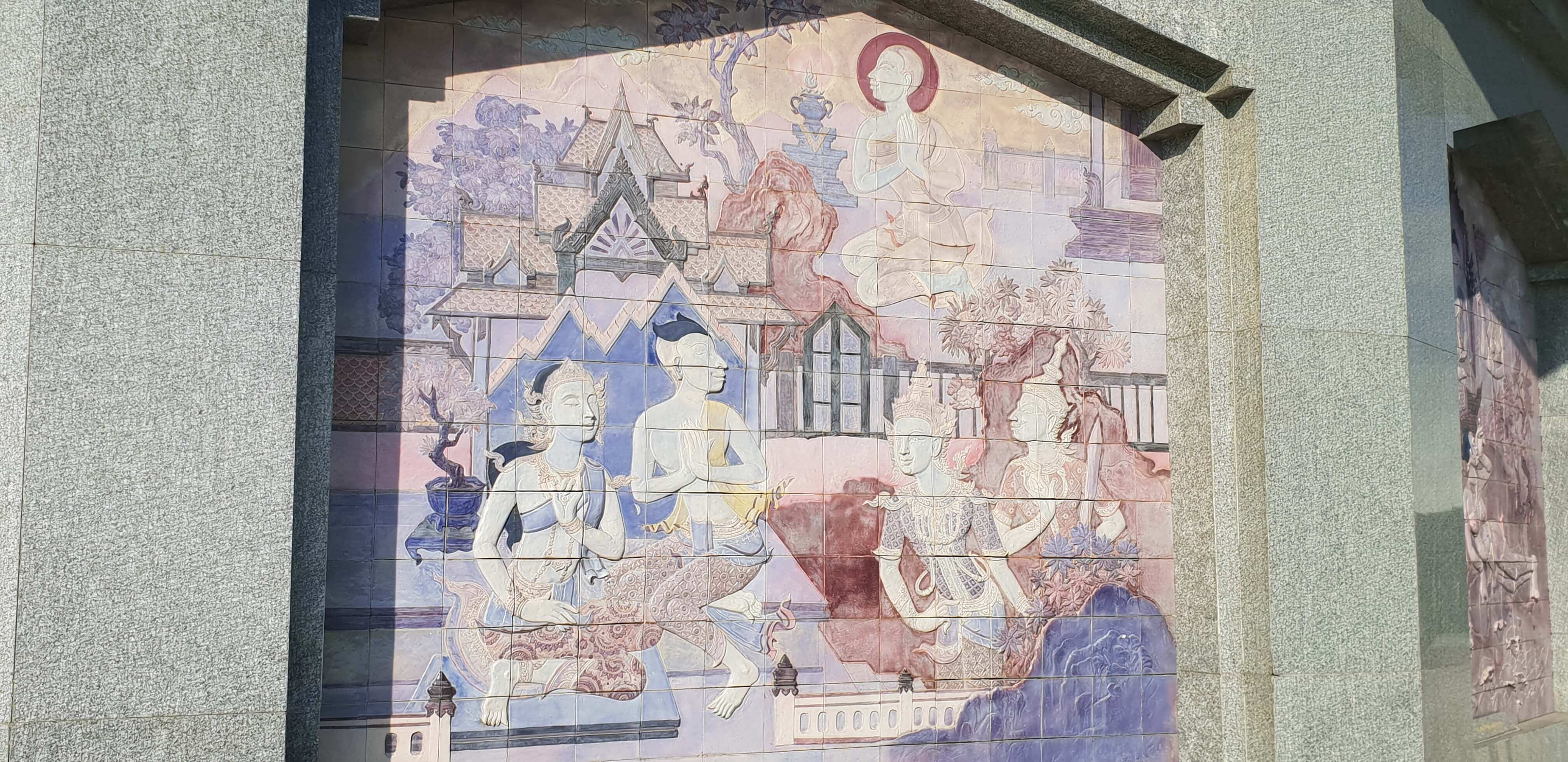Colourful painting in square tile frames on the outside wall of Queen's Pagoda