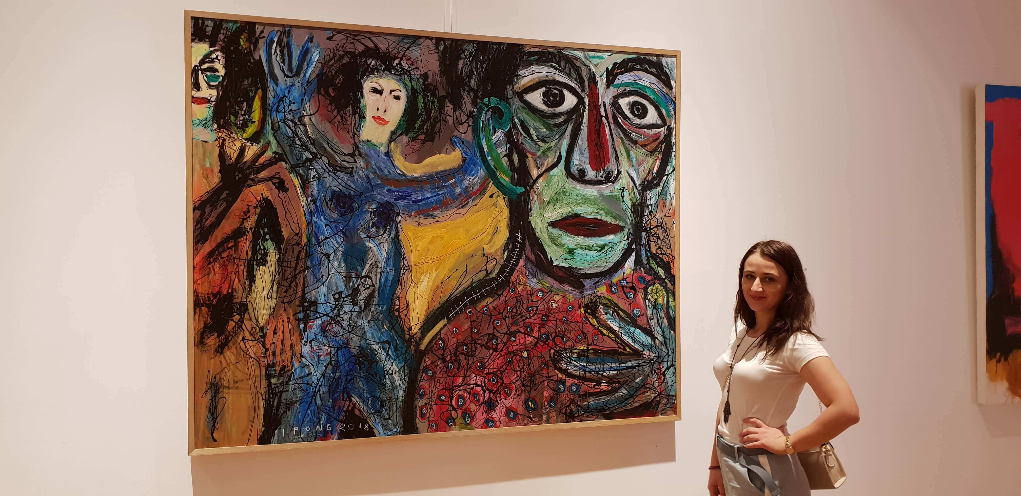 My friend Marinela posing with one of the contemporary works at the museum
