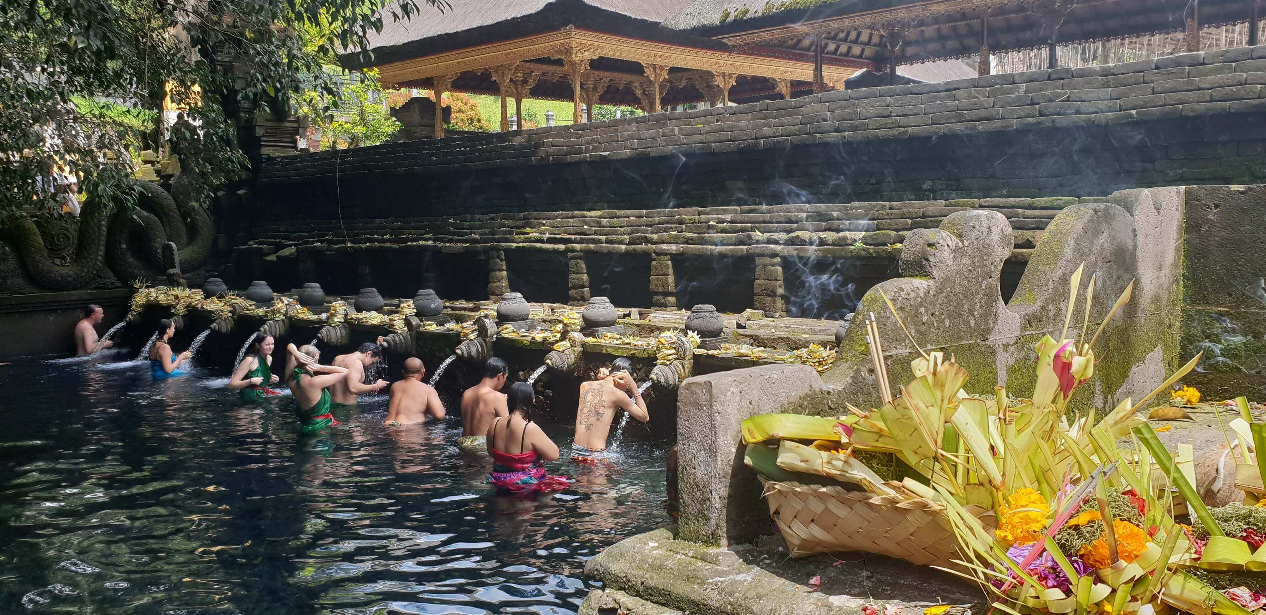 People of different ethnicities taking a holy dip in the Tirta Empul Water Temple