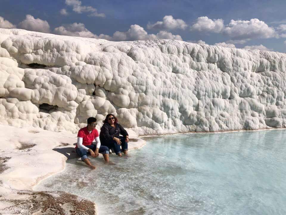 Sitting in the pristine blue travertine pools of Pamukkale is a surreal experience