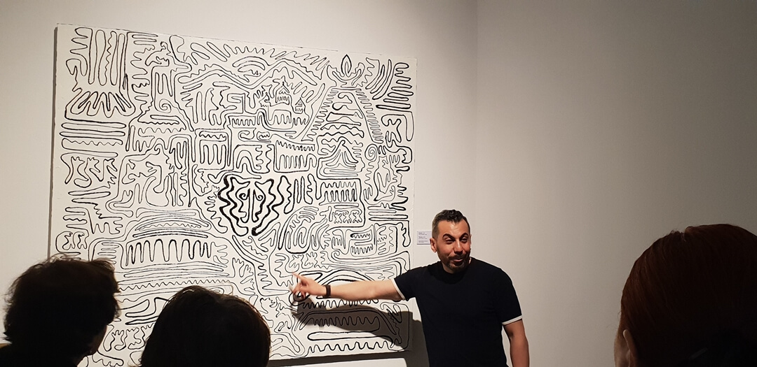 Artist Arman Nur explaining the concept of his Art Exhibit - The Fly