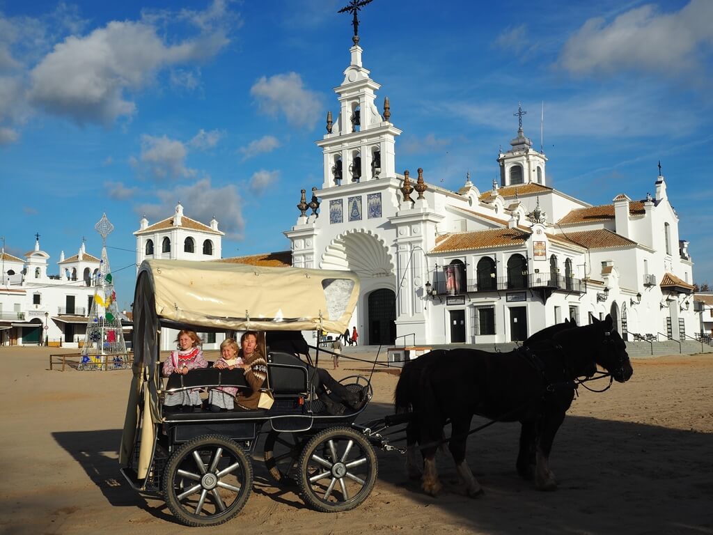 Exploring the El Rocio town on a horseback is one of the most unique things to do in Spain