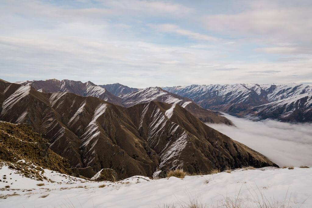 Hiking the Roy's Peak in Wanaka offers you the opportunity to walk in amongst the New Zealand sub-alpine tussock and snow environment