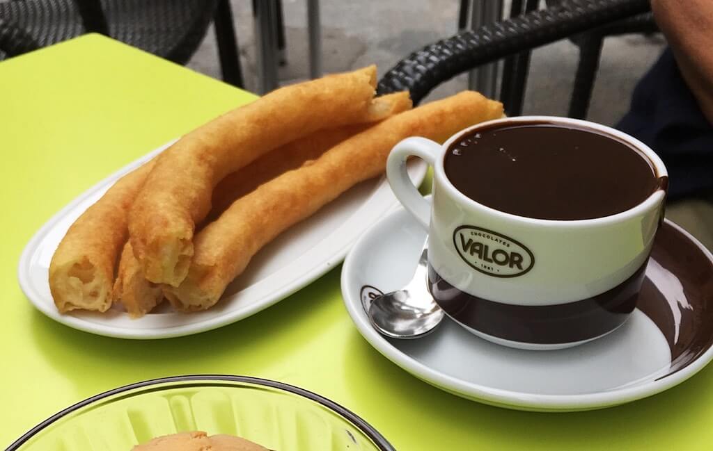 Tasting the mouthwatering combo of Chocolate with Churros in Madrid is a must-do activity in Spain