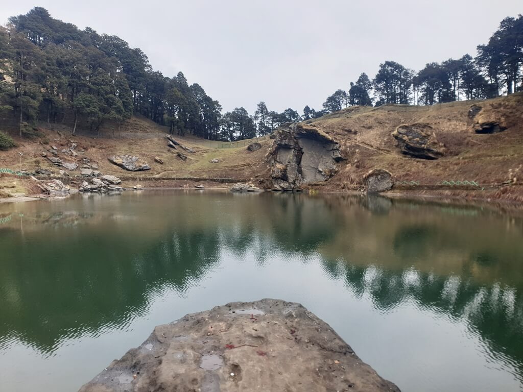 The water of the Serolsar lake is so clear that you can see a mirror reflection of the nearby cliff and it's trees