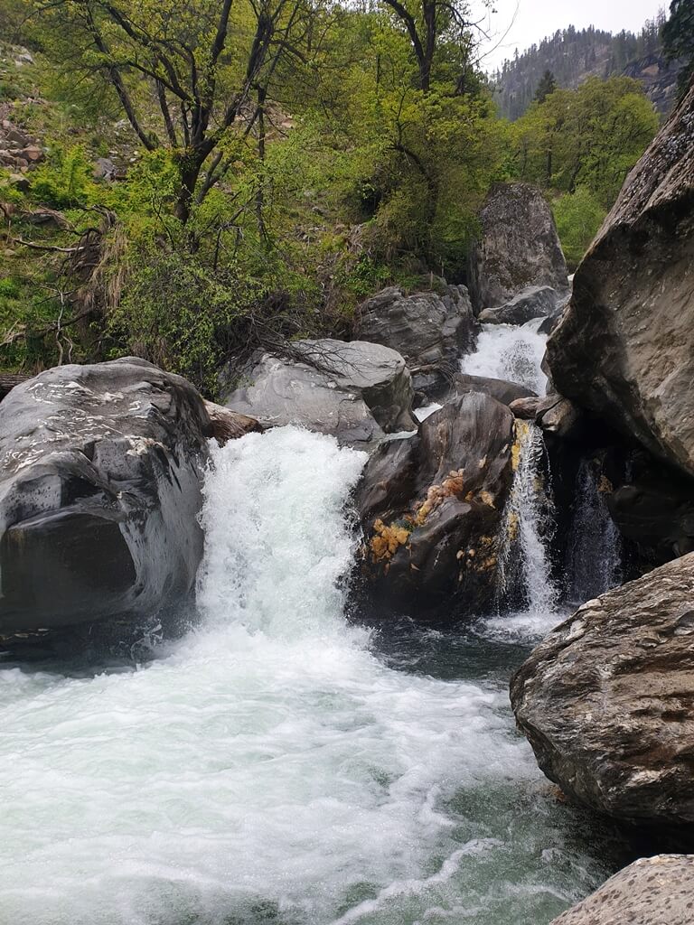 On your way to Kasheri village you can climb down from near the metal bridge and sit next to the Beas river tributary