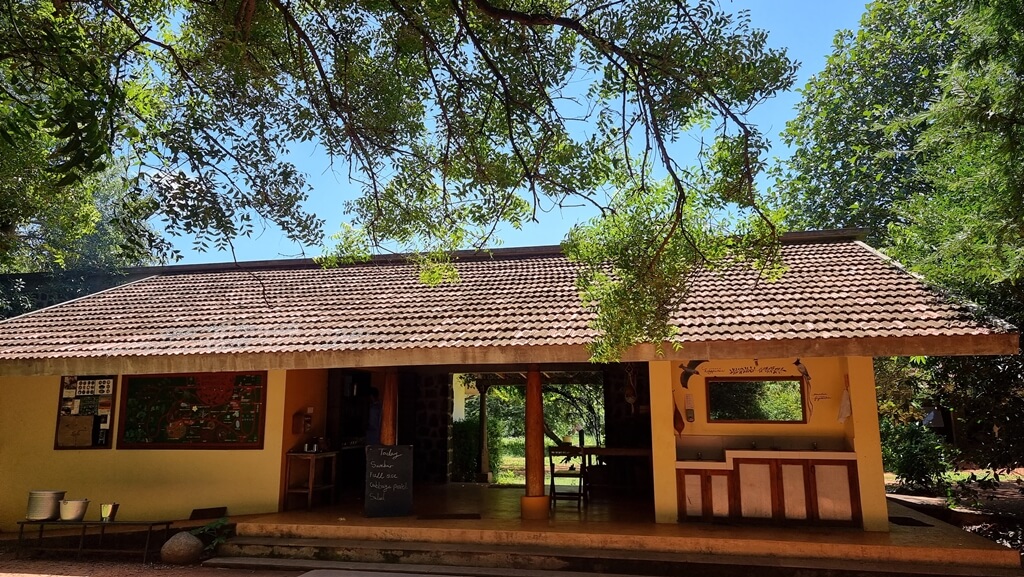 The kitchen and dining area inside Auroville Botanical Gardens where you can enjoy an organic farm lunch