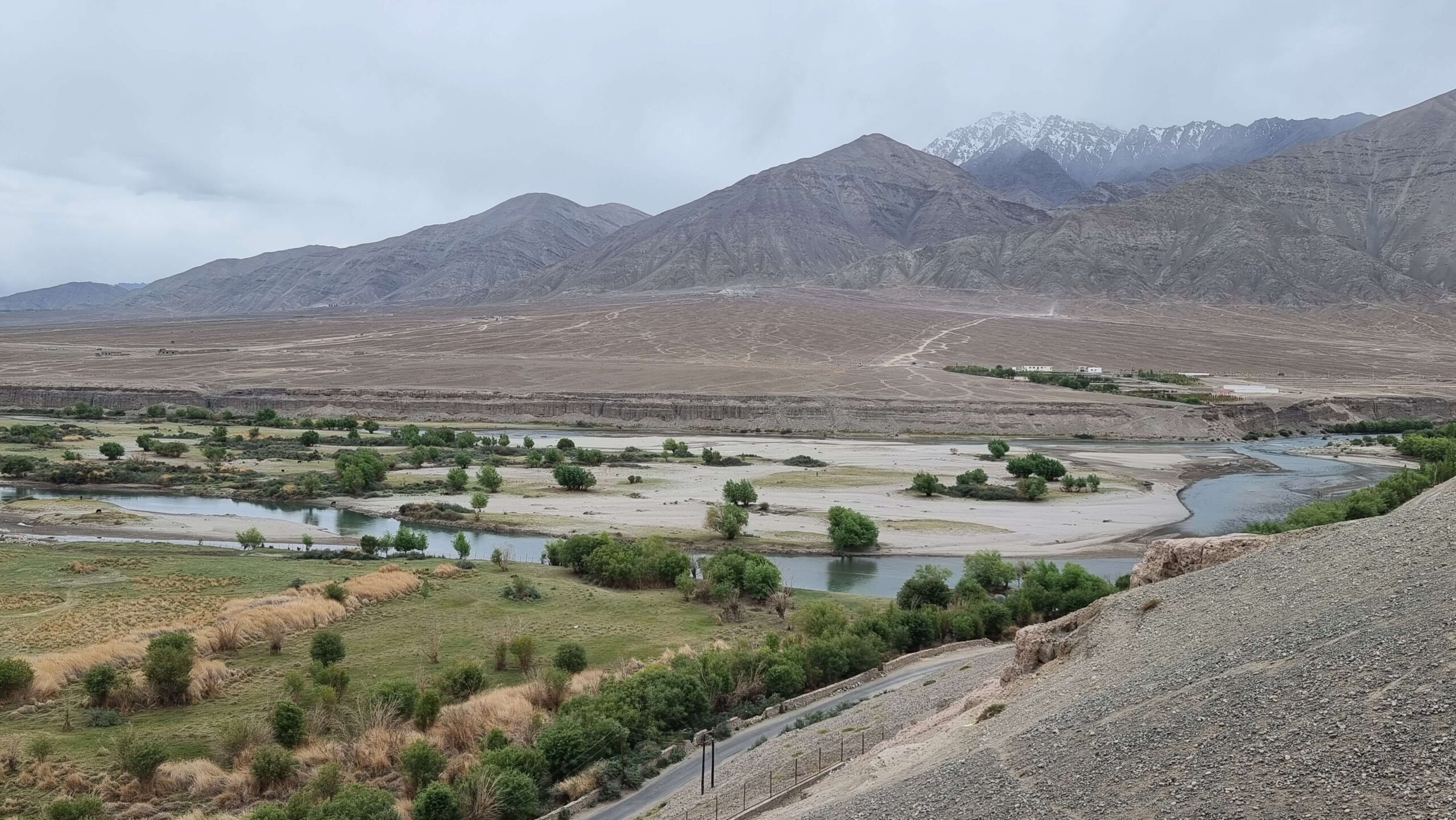 A gorgeous panoramic view of the Indus river, snow-clad peaks, Stok village & Pharka village