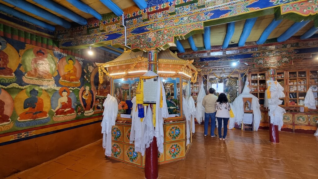 An inside view of the Gonkhang temple where the walls are painted with Buddhist deities and symbols