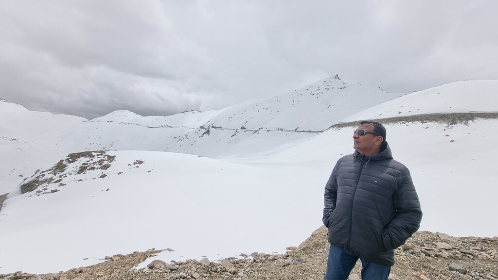 My dad admiring the sights and enjoying the lovely weather near Khardung La Mountain Pass