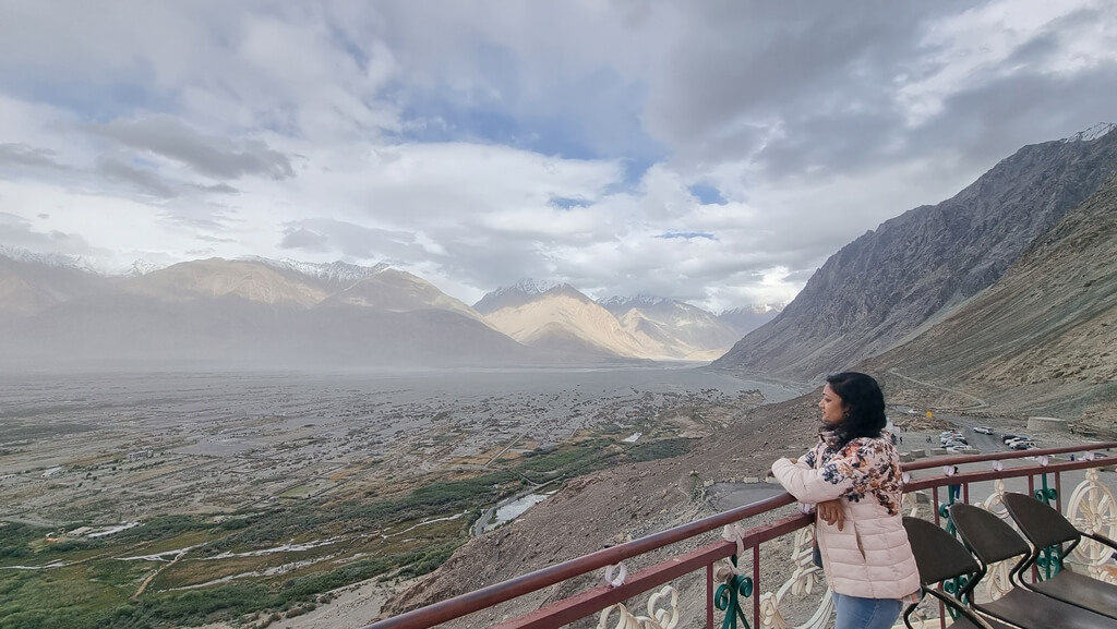 My mum enjoying an astounding panoramic view of the Nubra valley and the surrounding mountain landscape